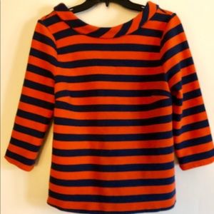 Biden orange and blue top.